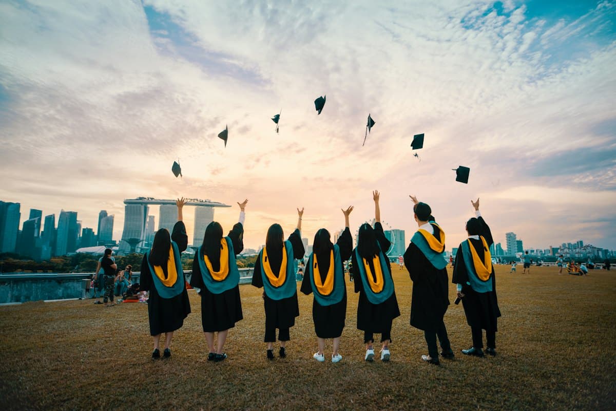 Class cap toss at sunset